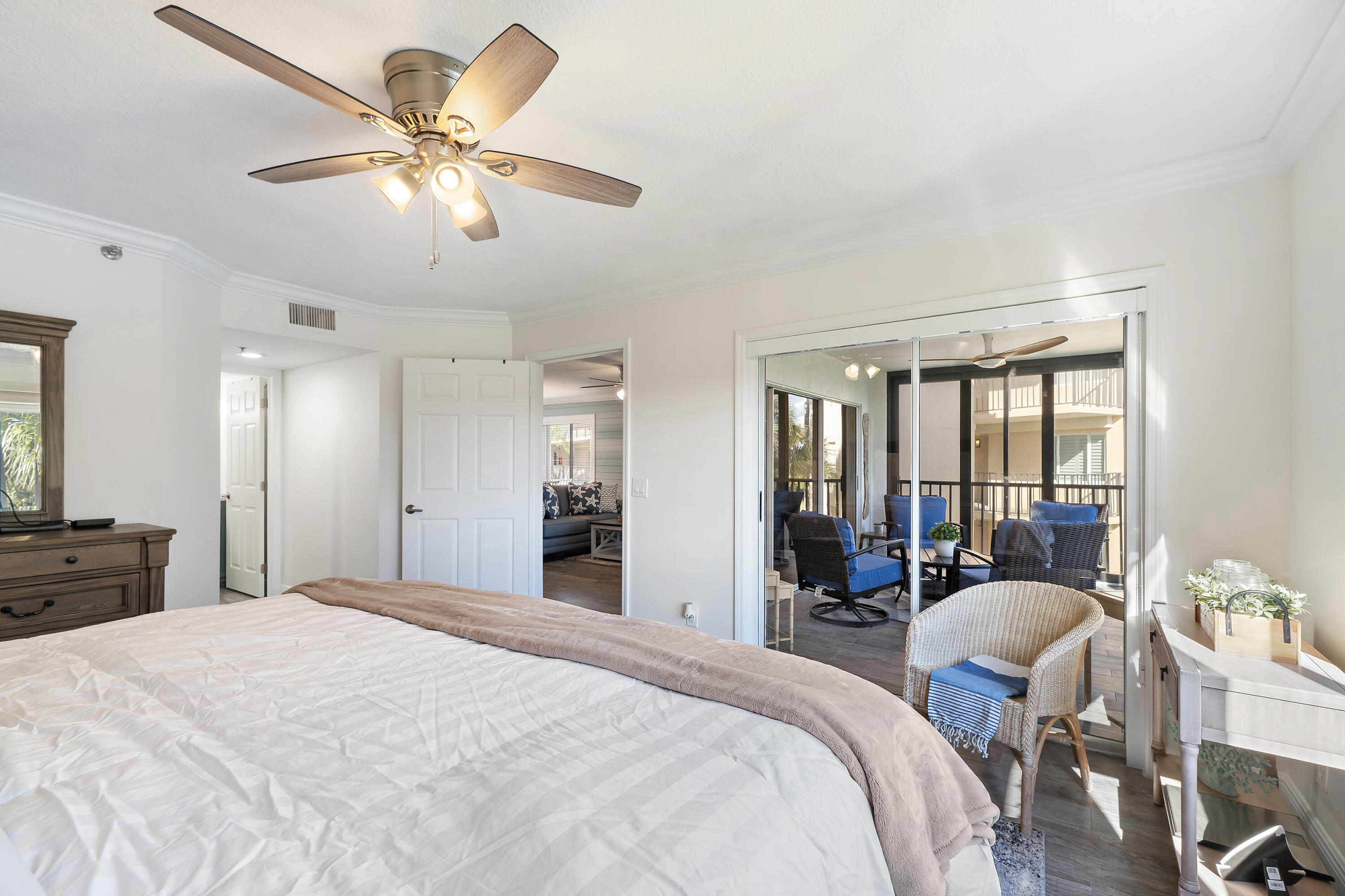 275 Palm Avenue, Unit A301 Jupiter, FL 33477 - Photo 24 of 38 a bedroom with a bed and lamp