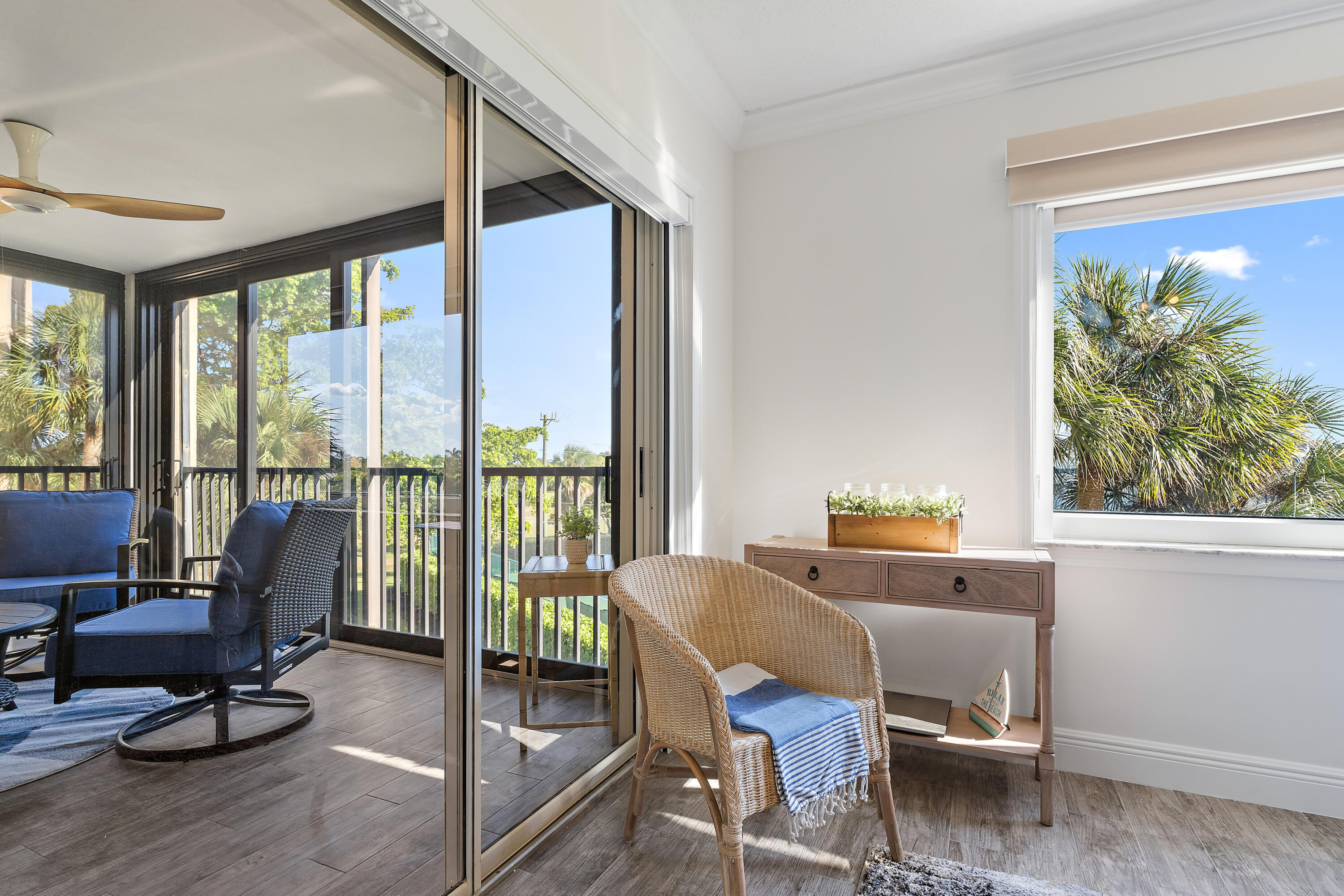 275 Palm Avenue, Unit A301 Jupiter, FL 33477 - Photo 26 of 38 a living room with furniture and floor to ceiling windows