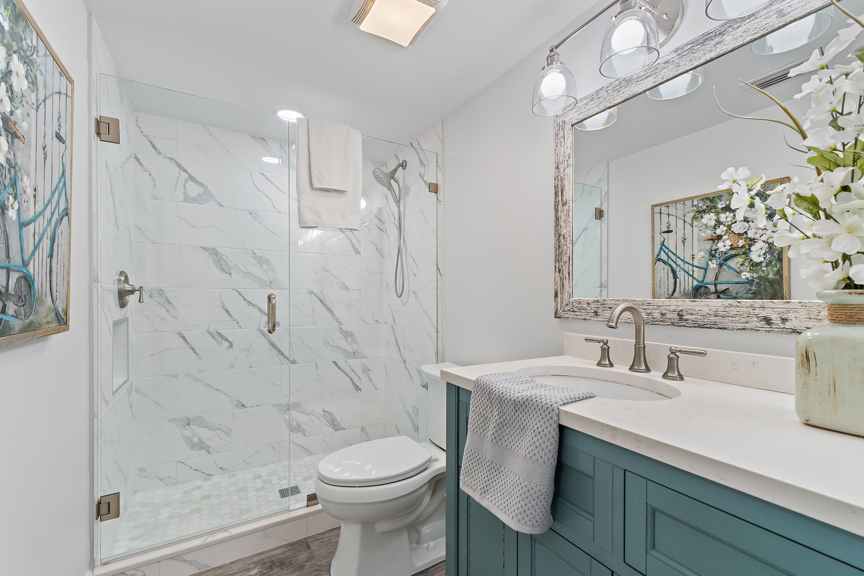 275 Palm Avenue, Unit A301 Jupiter, FL 33477 - Photo 28 of 38 a bathroom with a sink a toilet and shower