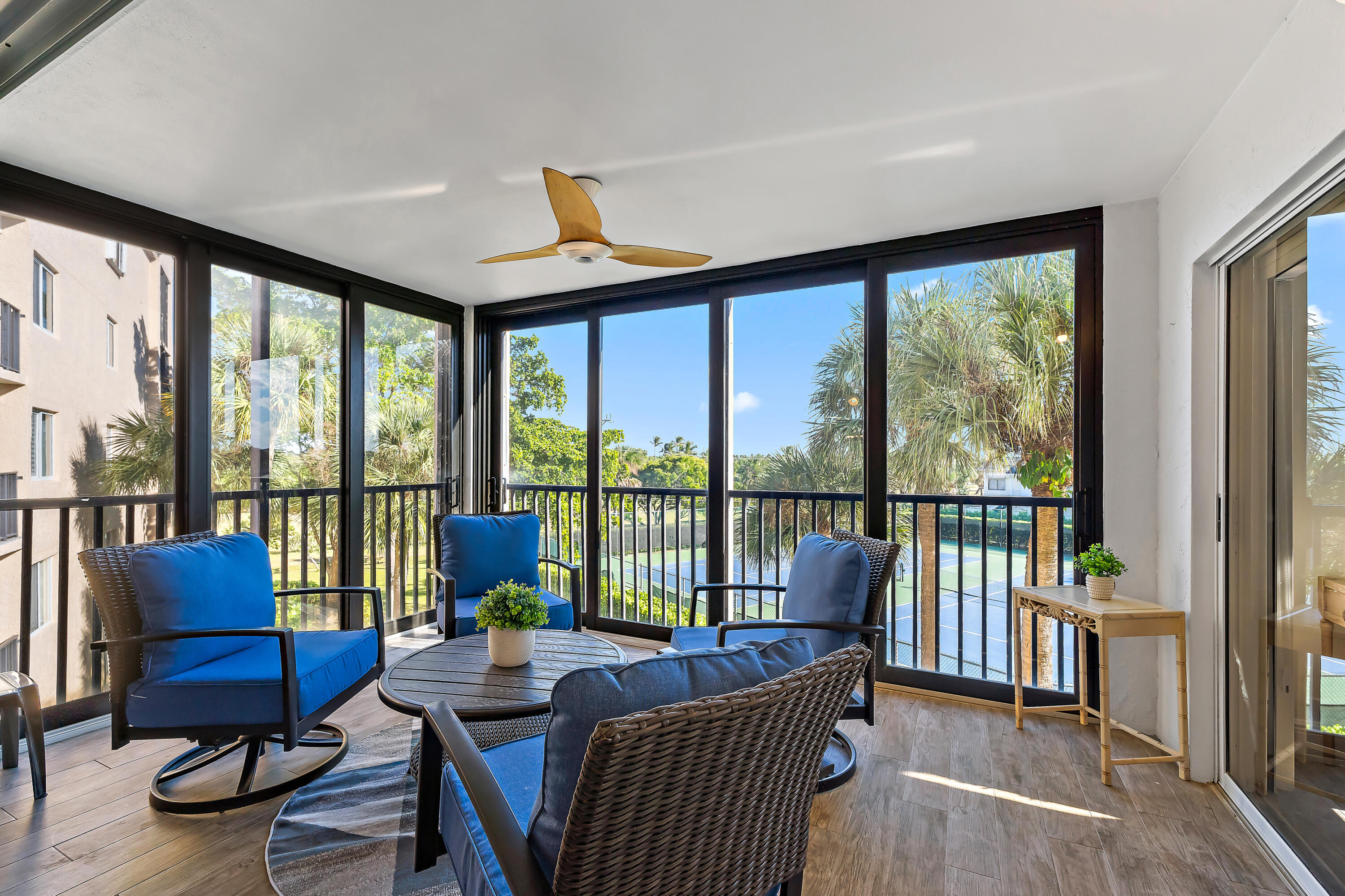 275 Palm Avenue, Unit A301 Jupiter, FL 33477 - Photo 31 of 38 a living room with furniture and floor to ceiling windows