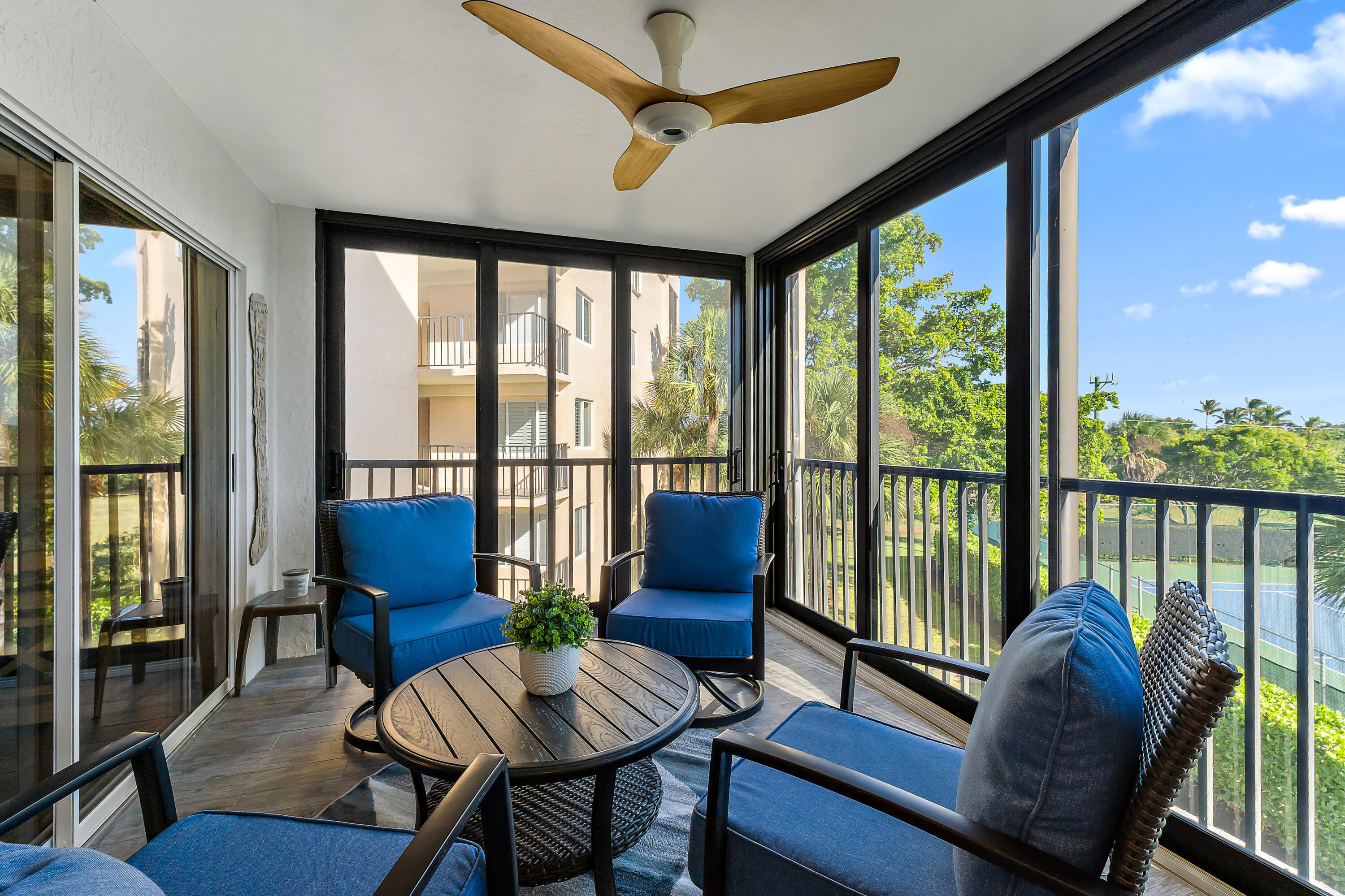 275 Palm Avenue, Unit A301 Jupiter, FL 33477 - Photo 33 of 38 a living room with furniture and a floor to ceiling window