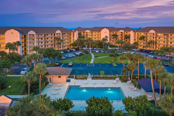 a view of swimming pool and outdoor seating