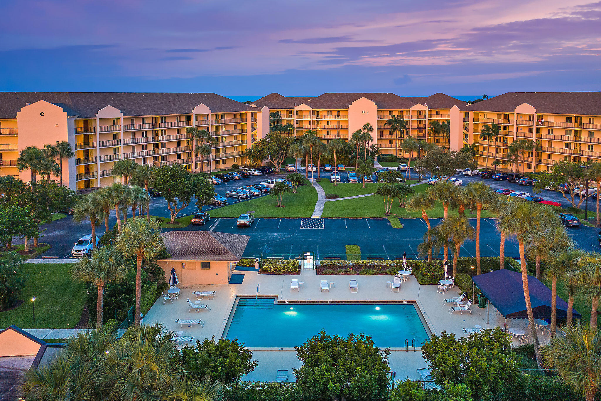 275 Palm Avenue, Unit A301 Jupiter, FL 33477 - Photo 34 of 38 a view of swimming pool and outdoor seating