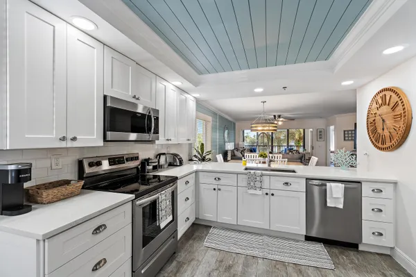 a kitchen with a sink and cabinets