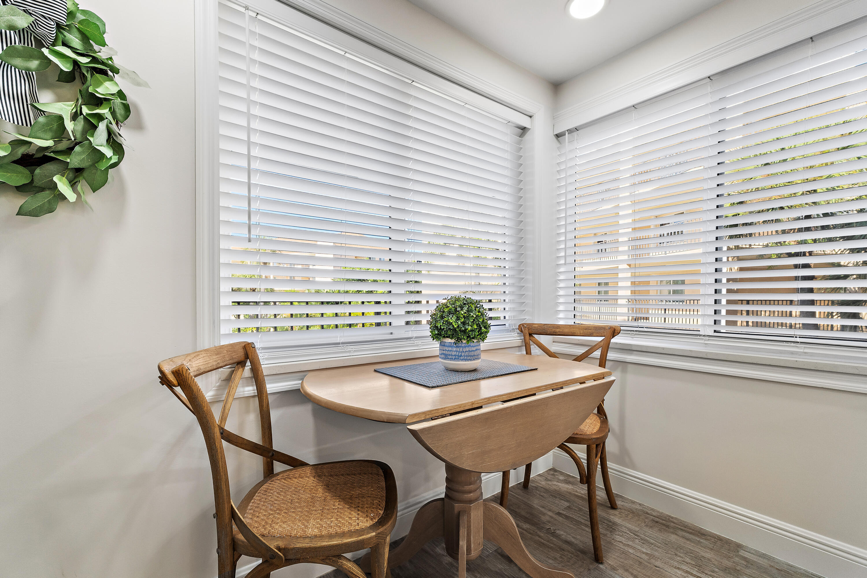 275 Palm Avenue, Unit A301 Jupiter, FL 33477 - Photo 8 of 38 a view of a dining room with furniture window and wooden floor