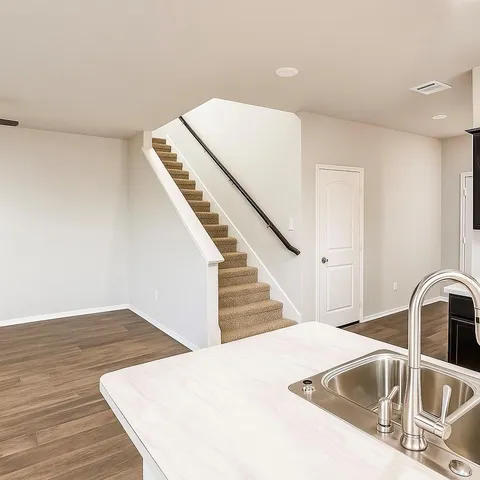 a view of staircase with white walls