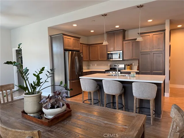a kitchen with a table and chairs