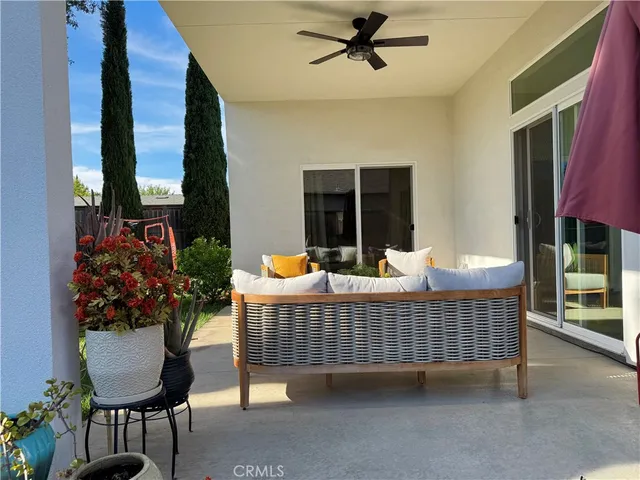 a outdoor living space with furniture and a potted plant