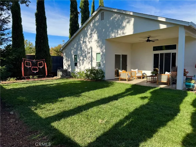 a front view of a house with a yard table and chairs