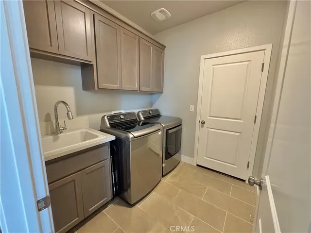 a view of a storage & utility room with sink