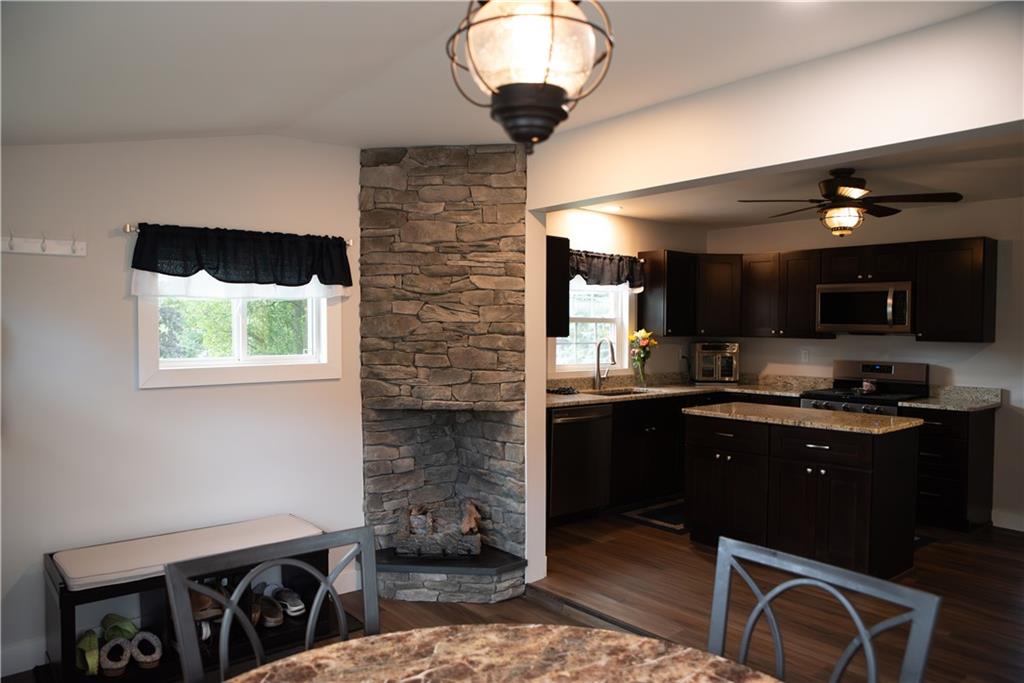 1302 Old Princeton Road New Castle, PA 16101 - Photo 9 of 33 Gas fireplace in seating area open to kitchen.