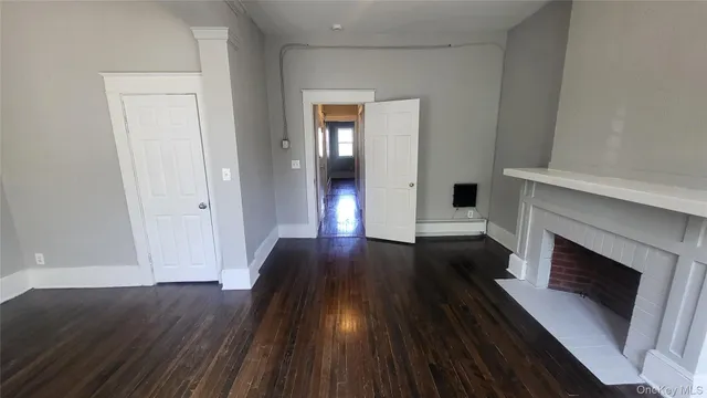 a view of gallery with wooden floor