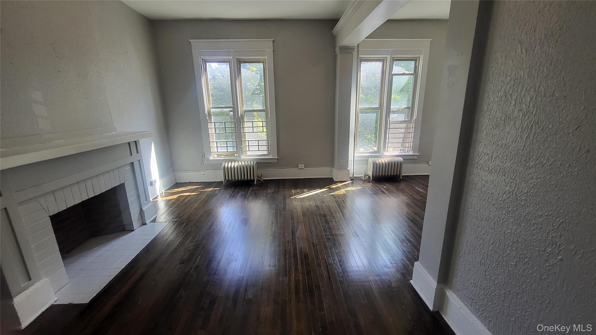 61 South Hamilton Street, Unit 2 Poughkeepsie, NY 12601 - Photo 14 of 19 a view of an empty room with wooden floor and a window