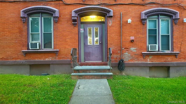 a front view of a house with a yard