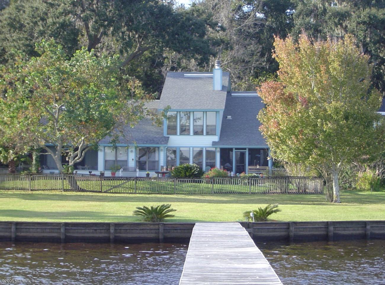 2900 Magnolia Road Orange Park, FL 32065 - Photo 1 of 6 a view of swimming pool with a yard and large trees