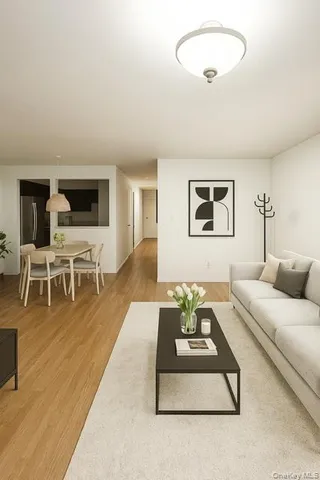 a living room with furniture wooden floor and a table