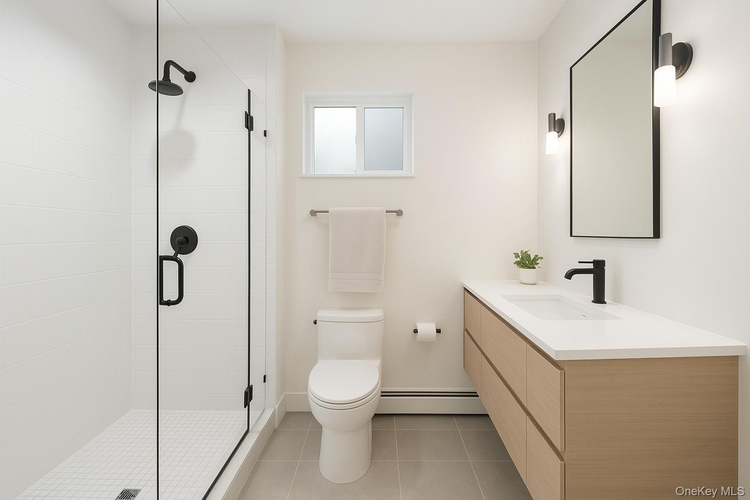 112-11 75th Avenue, Unit 3 Queens, NY 11375 - Photo 6 of 6 a bathroom with a sink a toilet and shower