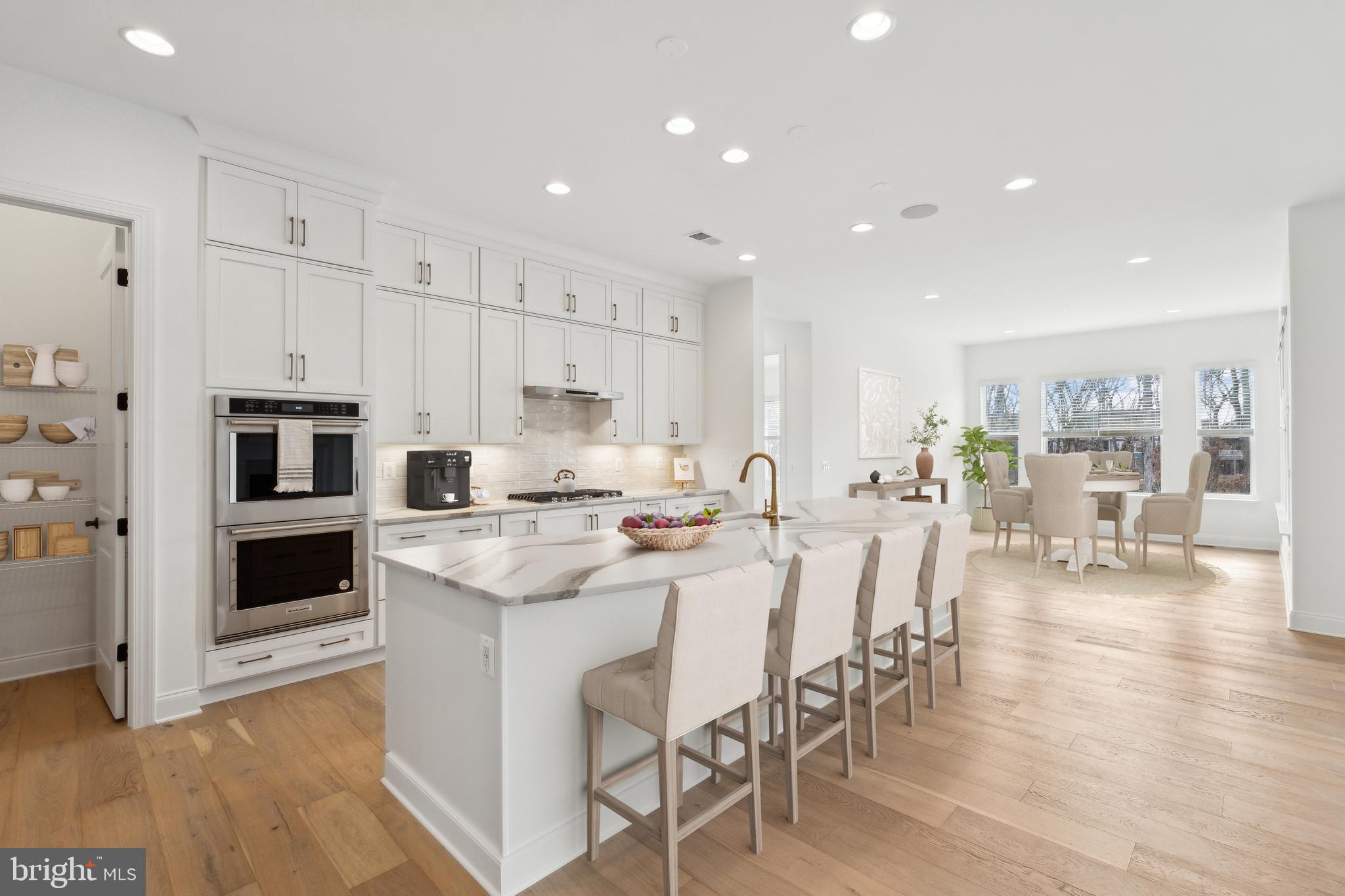107 Bittern Ct Lake Front Royal, VA 22630 - Photo 2 of 65 a kitchen with stainless steel appliances kitchen island granite countertop a table chairs and a refrigerator