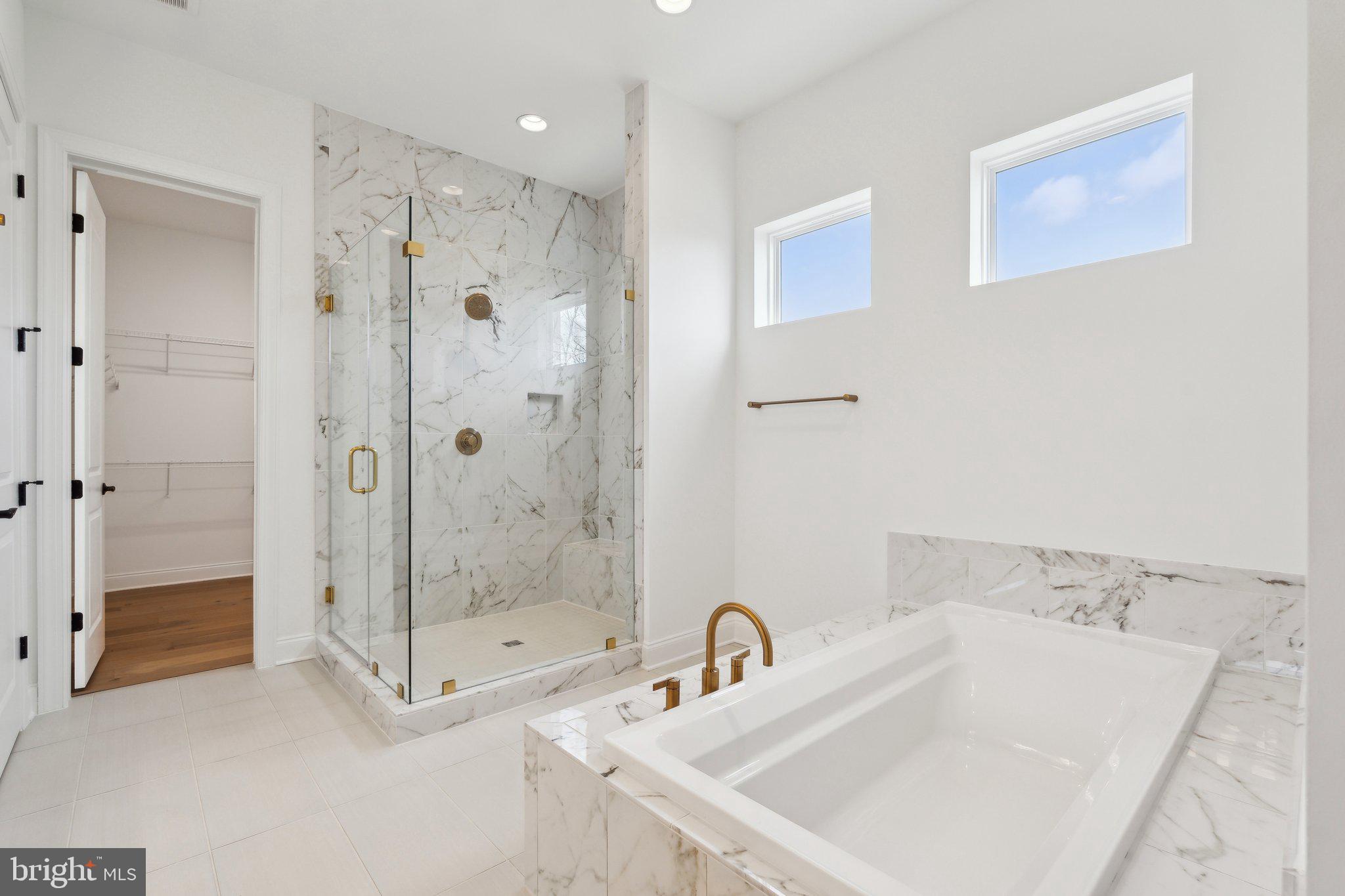 107 Bittern Ct Lake Front Royal, VA 22630 - Photo 25 of 65 a bathroom with a shower sink and mirror