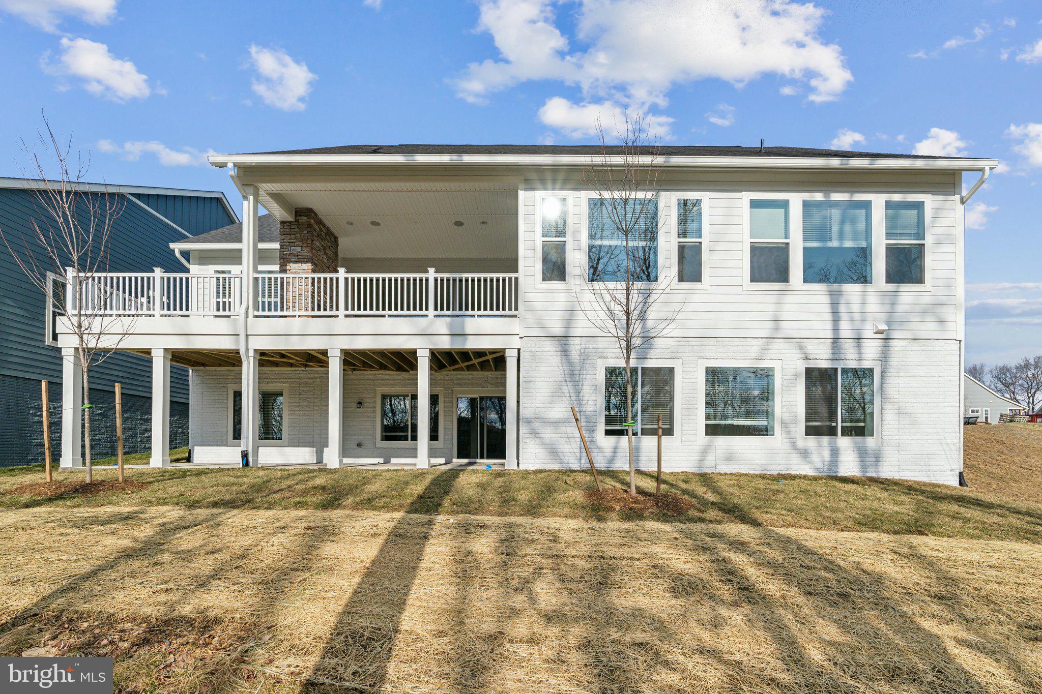 107 Bittern Ct Lake Front Royal, VA 22630 - Photo 42 of 65 a view of a large building with a outdoor space