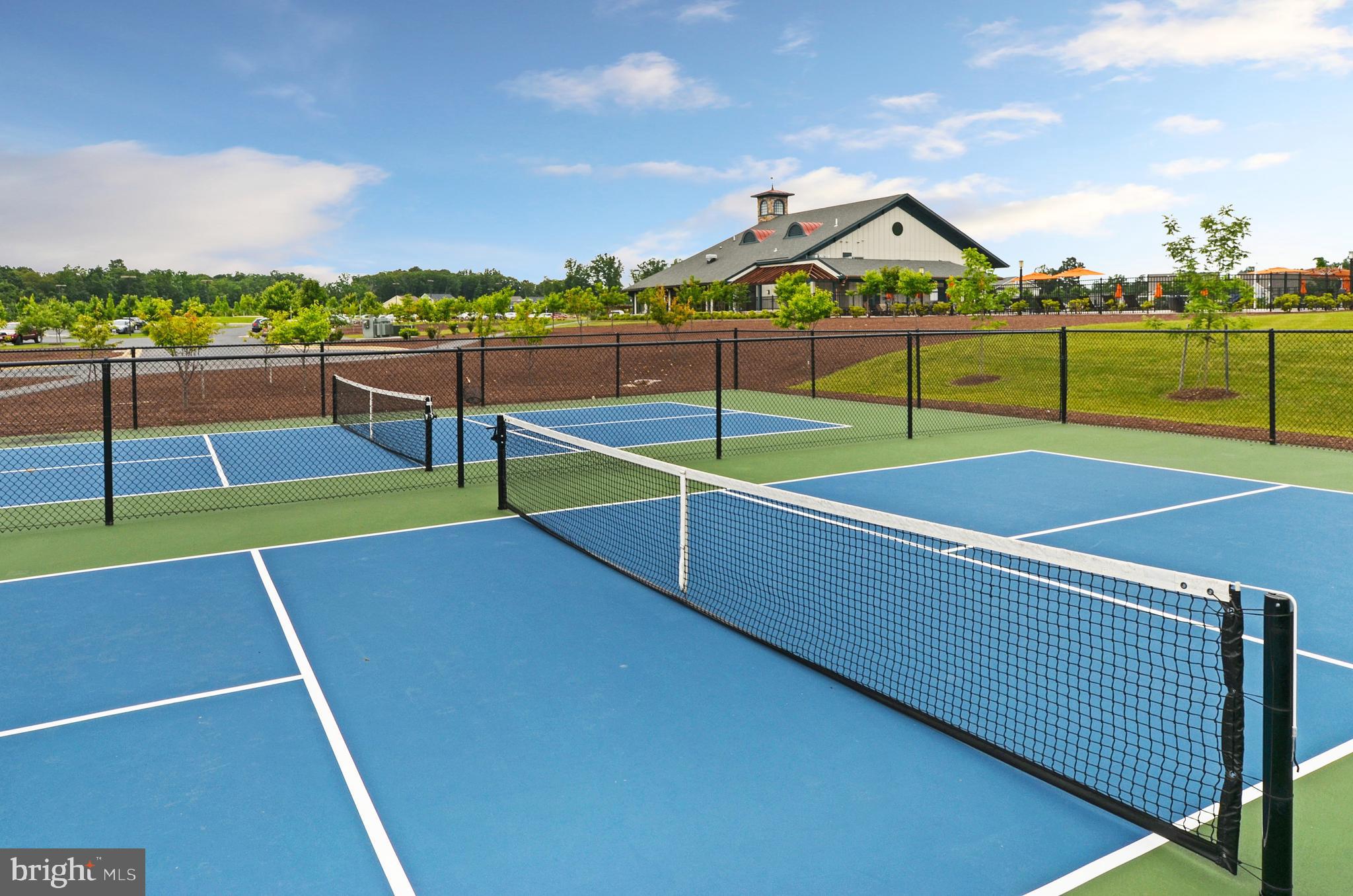 107 Bittern Ct Lake Front Royal, VA 22630 - Photo 53 of 65 a view of a tennis court with lots of buildings in the background