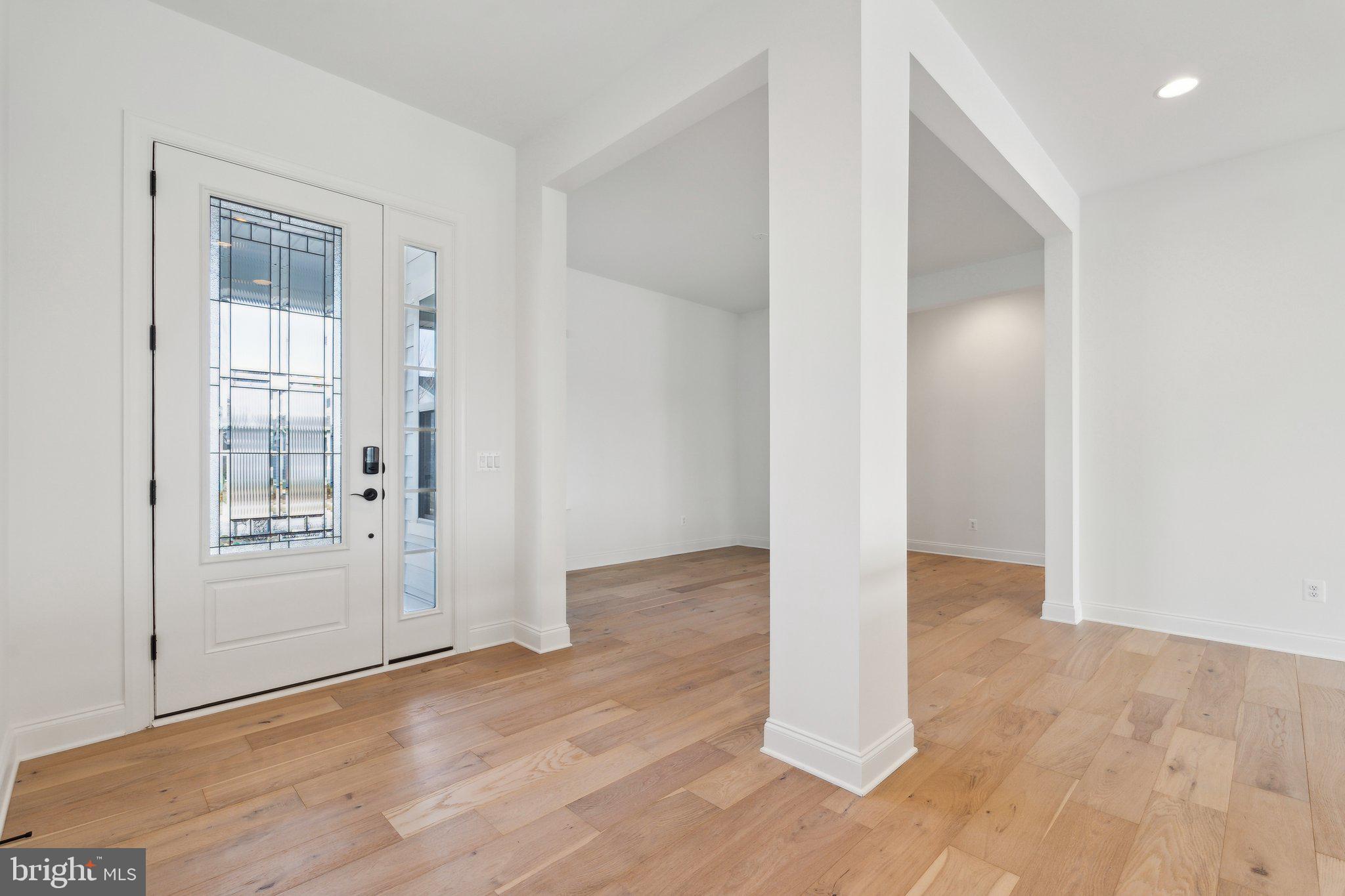 107 Bittern Ct Lake Front Royal, VA 22630 - Photo 7 of 65 an empty room with wooden floor and windows