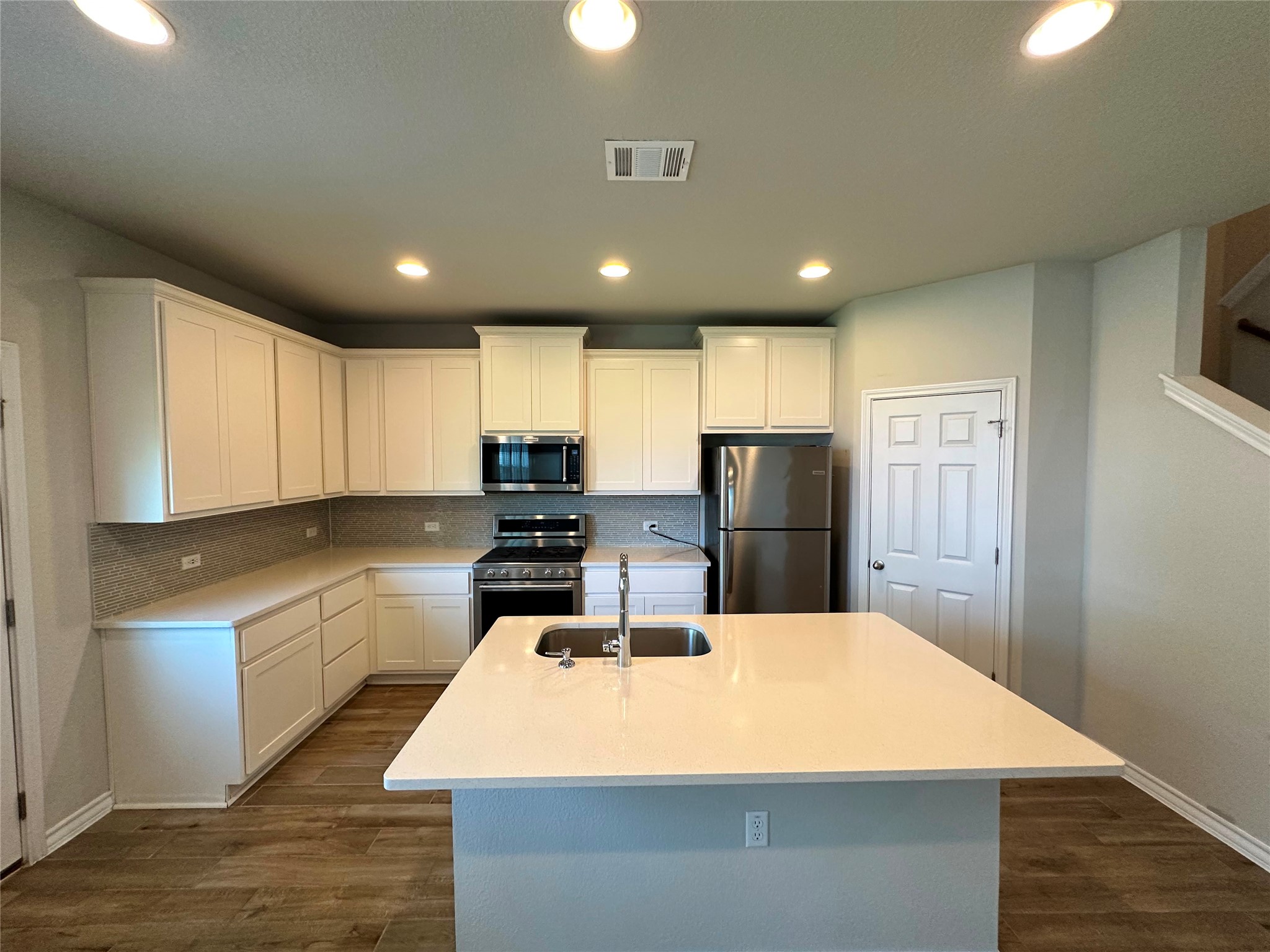 1624 Caballo Blanco Road Austin, TX 78725 - Photo 5 of 23 A well-appointed kitchen showcasing contemporary finishes and practical design.