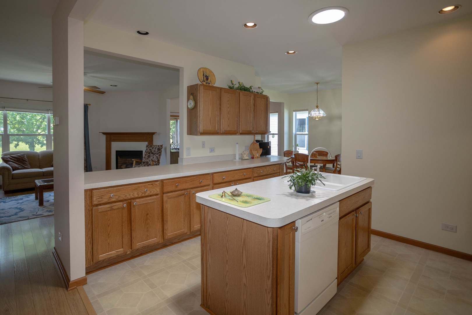 212 Rodeo Drive, Unit 2179 Grayslake, IL 60030 - Photo 10 of 31 a kitchen with a sink stove and cabinets