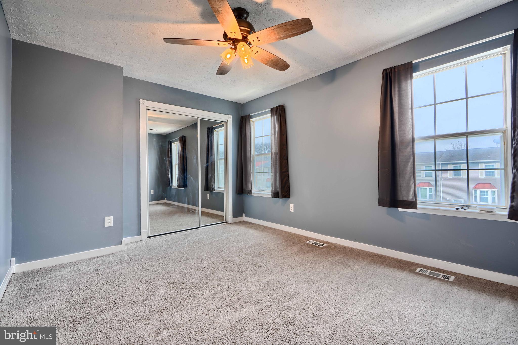 418 Kosoak Road Middle River, MD 21220 - Photo 15 of 25 an empty room with windows and fan