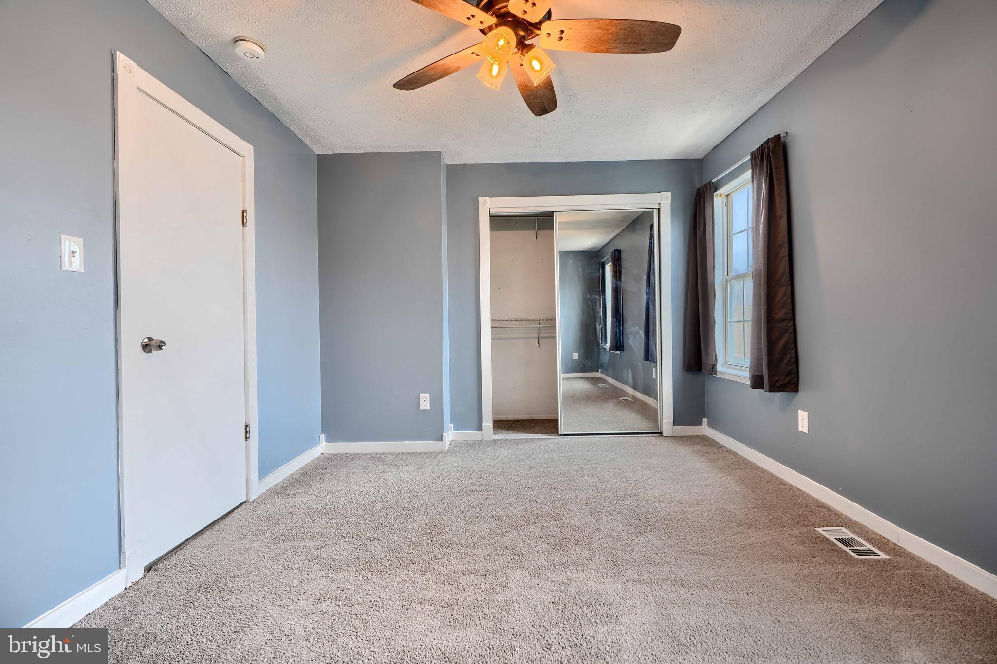 418 Kosoak Road Middle River, MD 21220 - Photo 16 of 25 a view of a livingroom with a ceiling fan and window