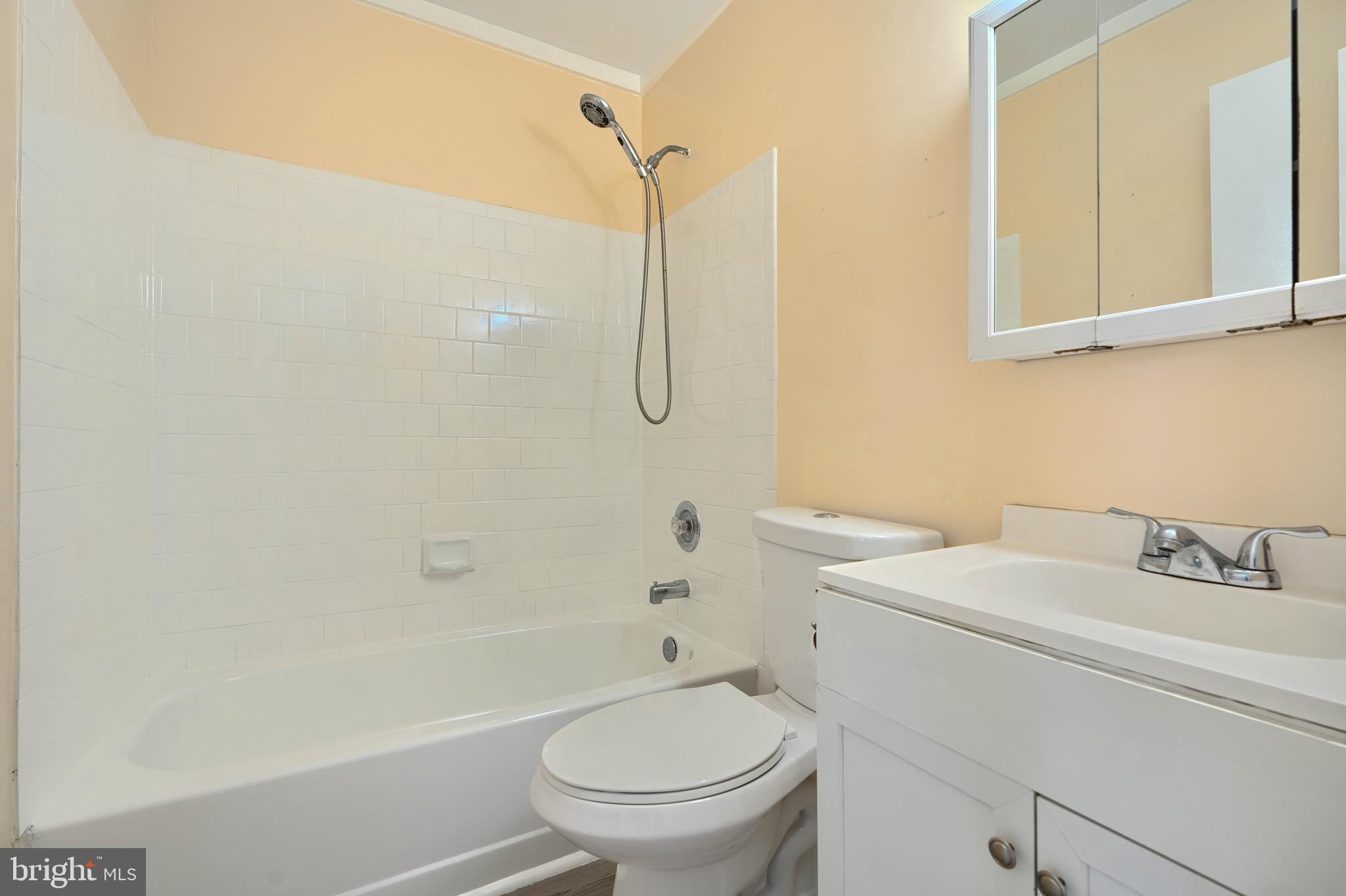 418 Kosoak Road Middle River, MD 21220 - Photo 17 of 25 a bathroom with a toilet sink vanity and shower