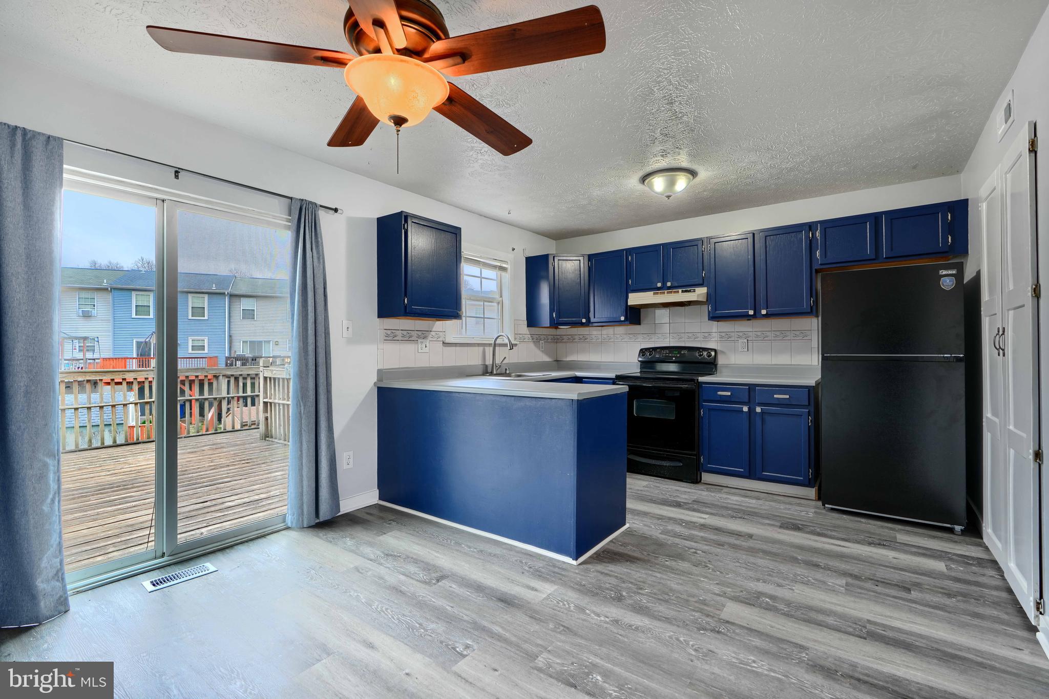 418 Kosoak Road Middle River, MD 21220 - Photo 6 of 25 a kitchen with stainless steel appliances granite countertop a refrigerator stove a sink dishwasher and a refrigerator