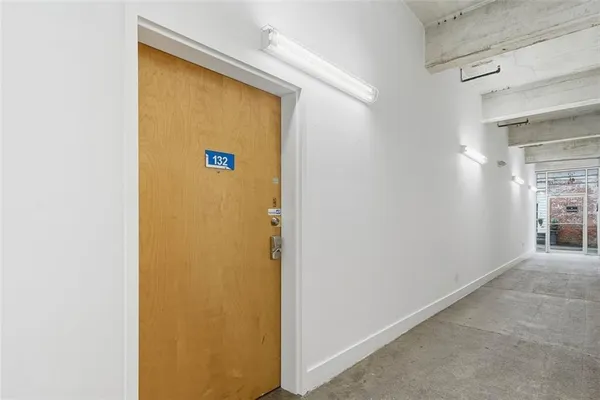a bathroom with a toilet a sink and shower