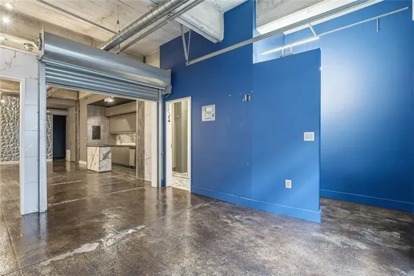 a kitchen with a sink and refrigerator