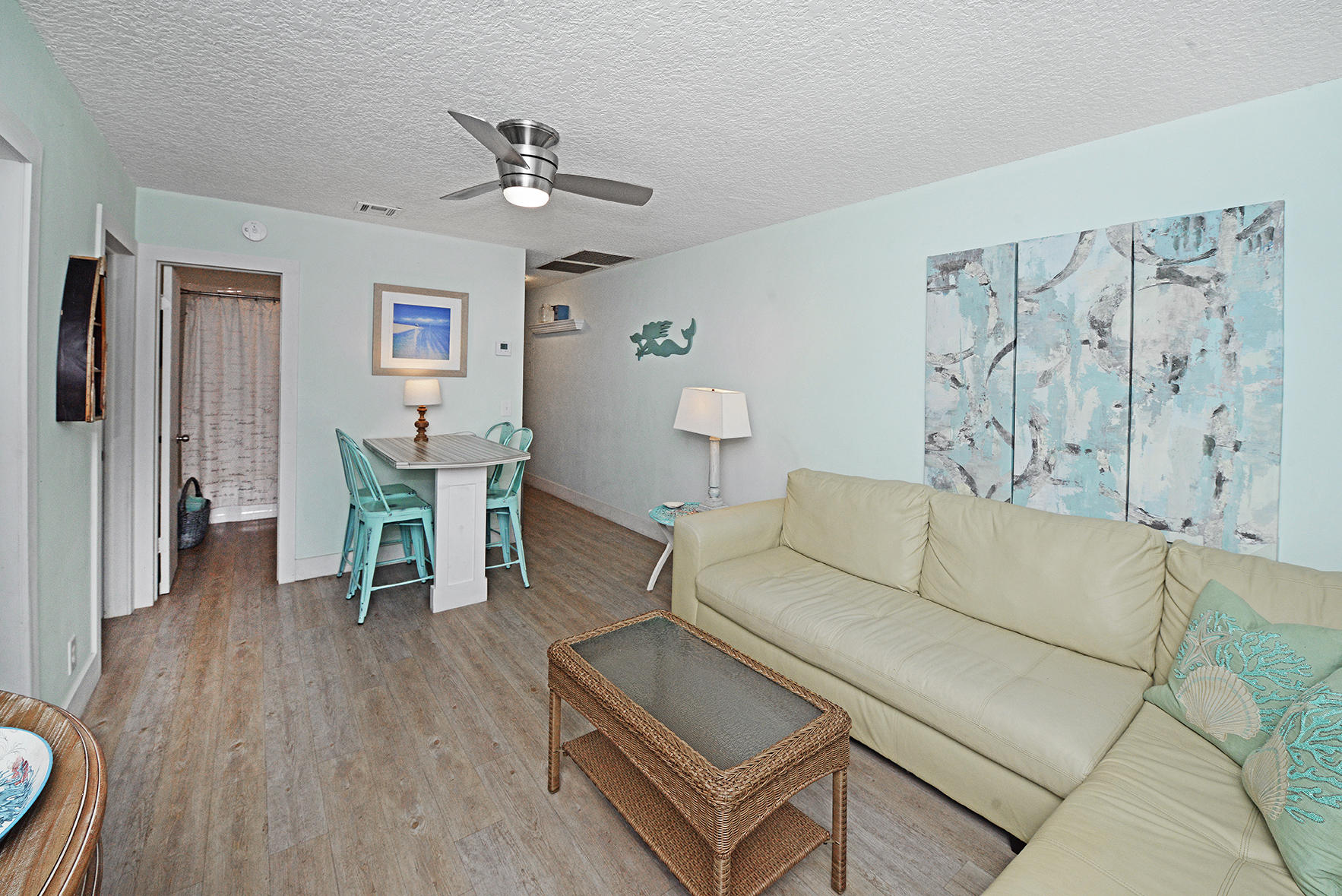 1257 Beach Road Singer Island, FL 33404 - Photo 16 of 71 a living room with furniture and wooden floor