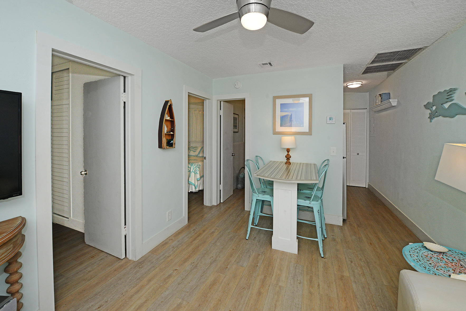1257 Beach Road Singer Island, FL 33404 - Photo 17 of 71 a dining room with furniture and wooden floor
