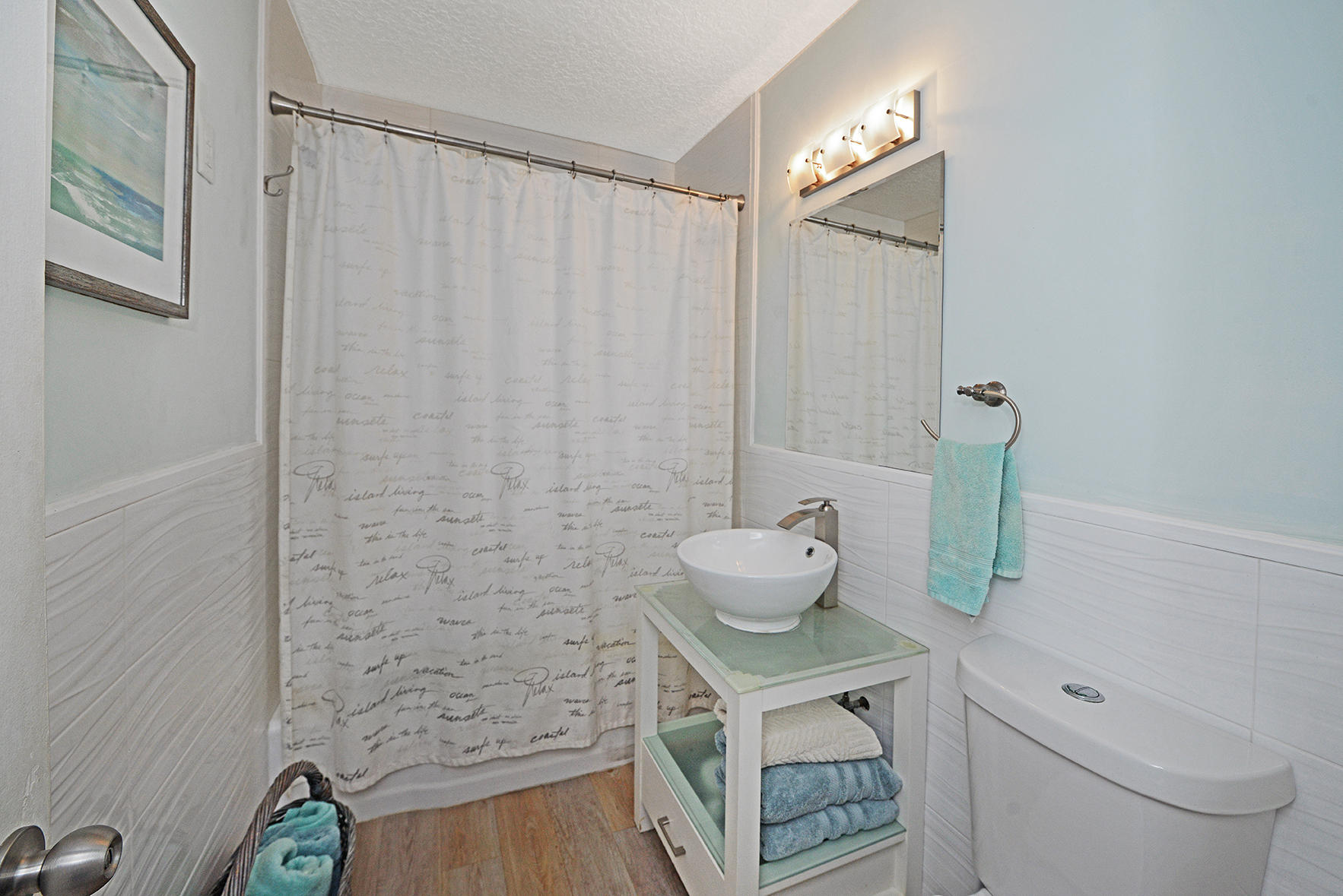 1257 Beach Road Singer Island, FL 33404 - Photo 20 of 71 a bathroom with a sink a toilet and shower