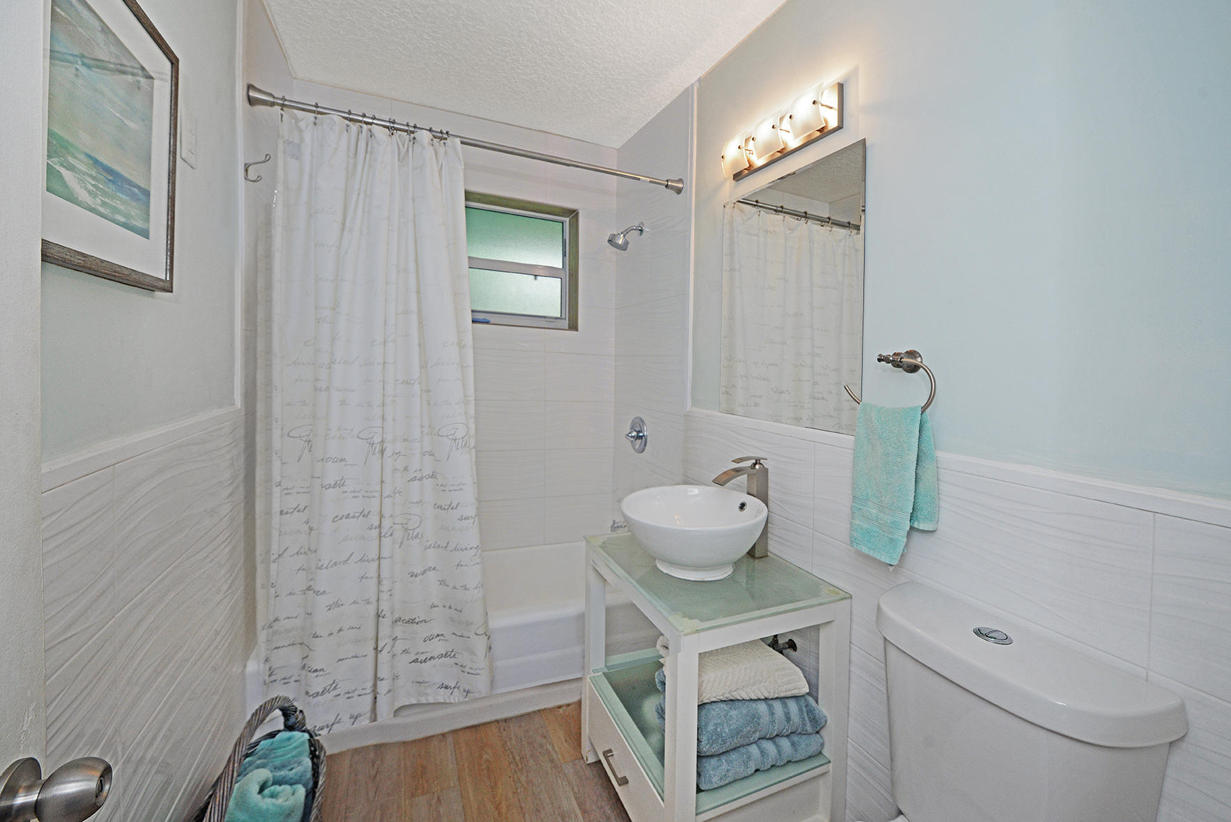 1257 Beach Road Singer Island, FL 33404 - Photo 21 of 71 a bathroom with a sink toilet and shower