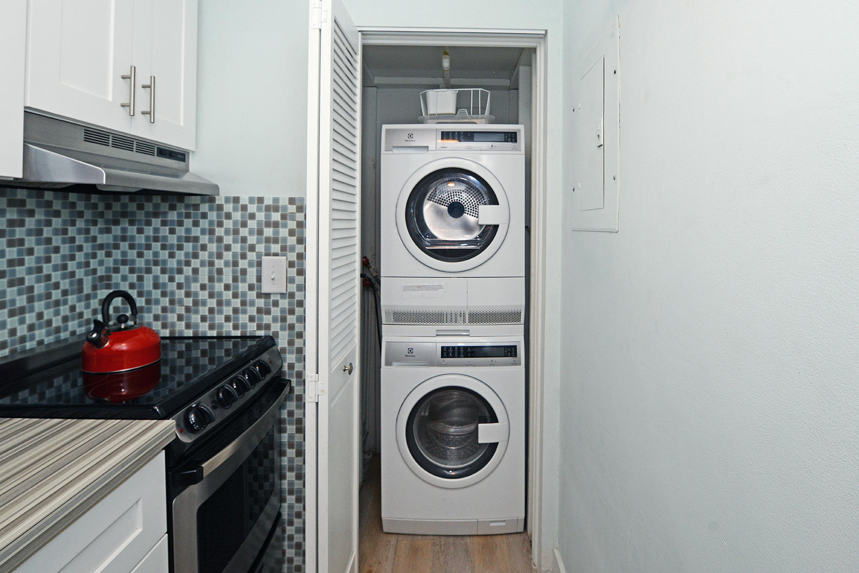 1257 Beach Road Singer Island, FL 33404 - Photo 27 of 71 a view of a kitchen with washer and dryer