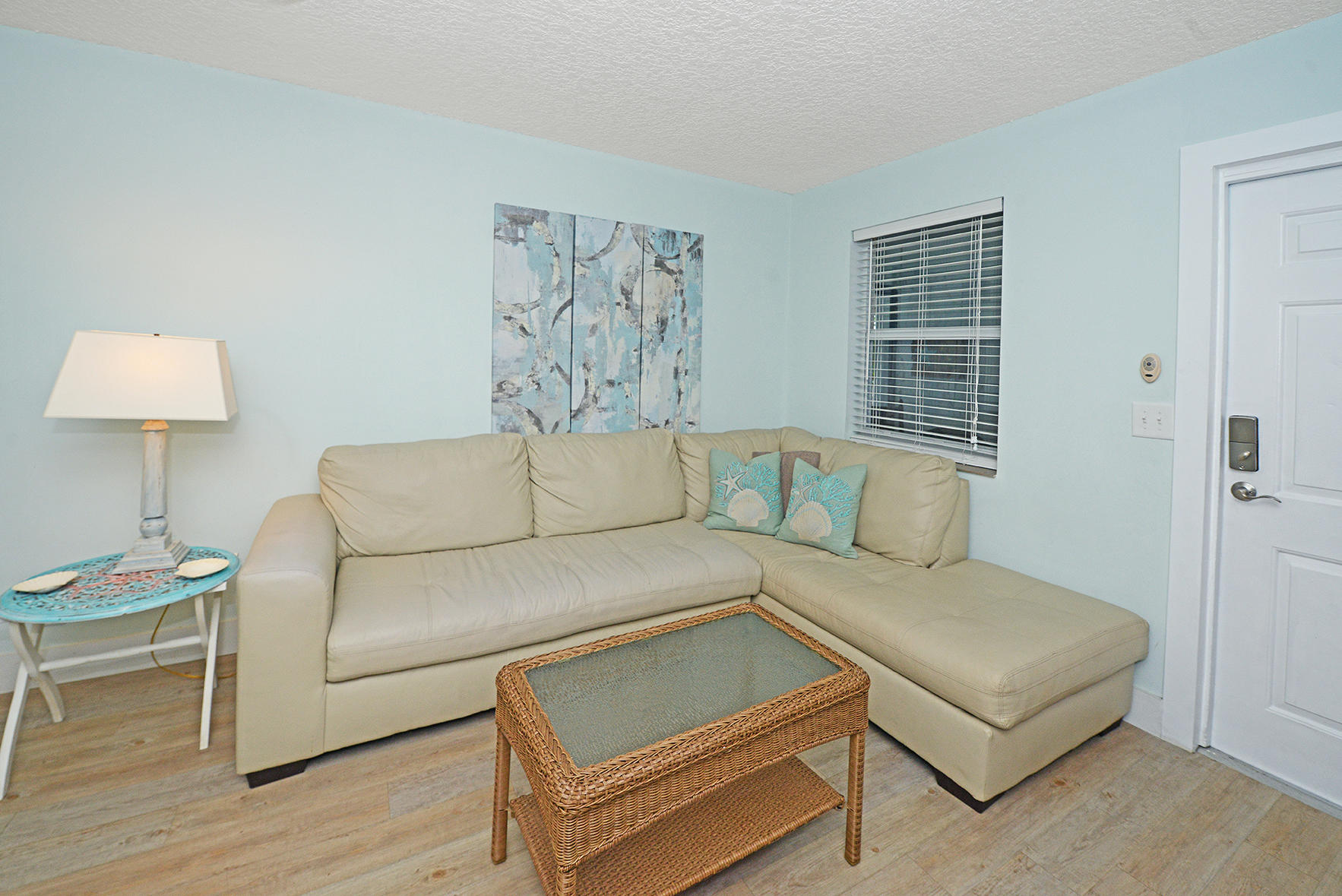 1257 Beach Road Singer Island, FL 33404 - Photo 30 of 71 a living room with furniture and a window
