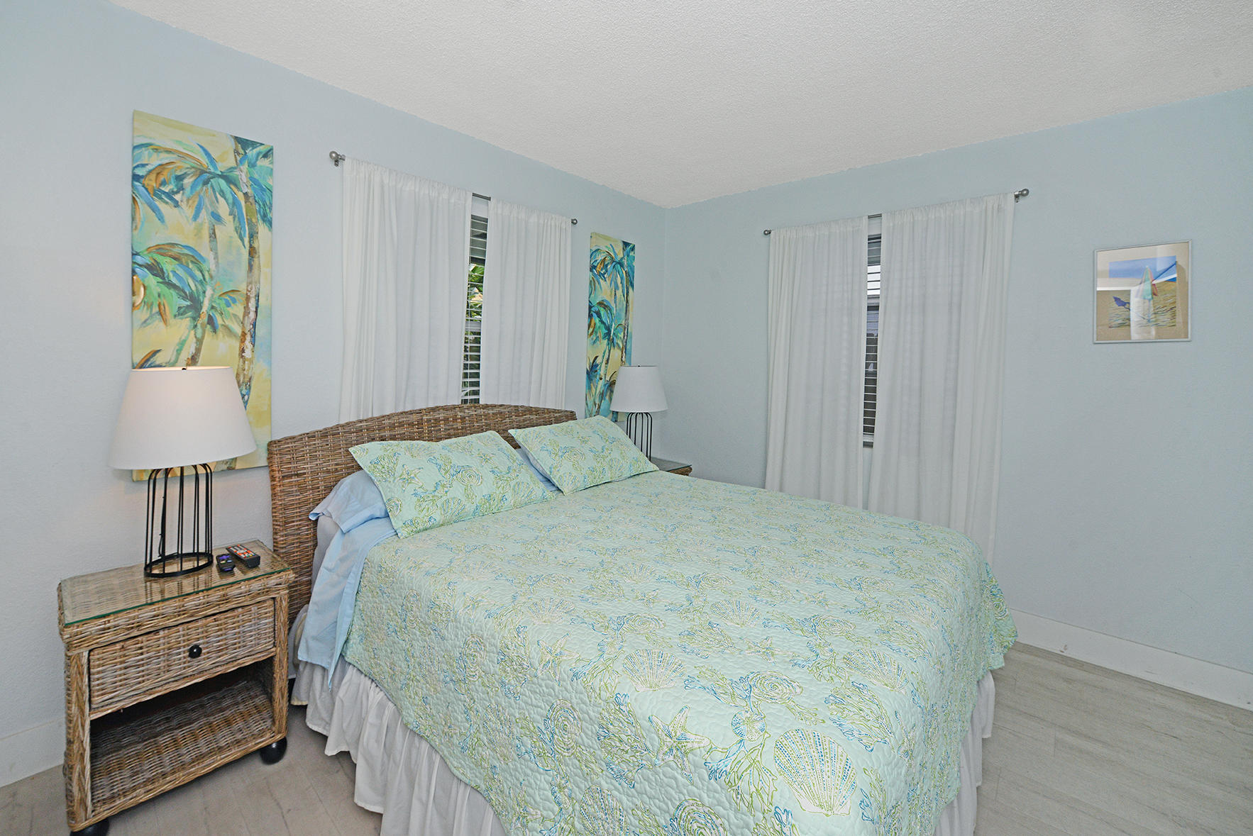 1257 Beach Road Singer Island, FL 33404 - Photo 37 of 71 a bedroom with a bed and a couch
