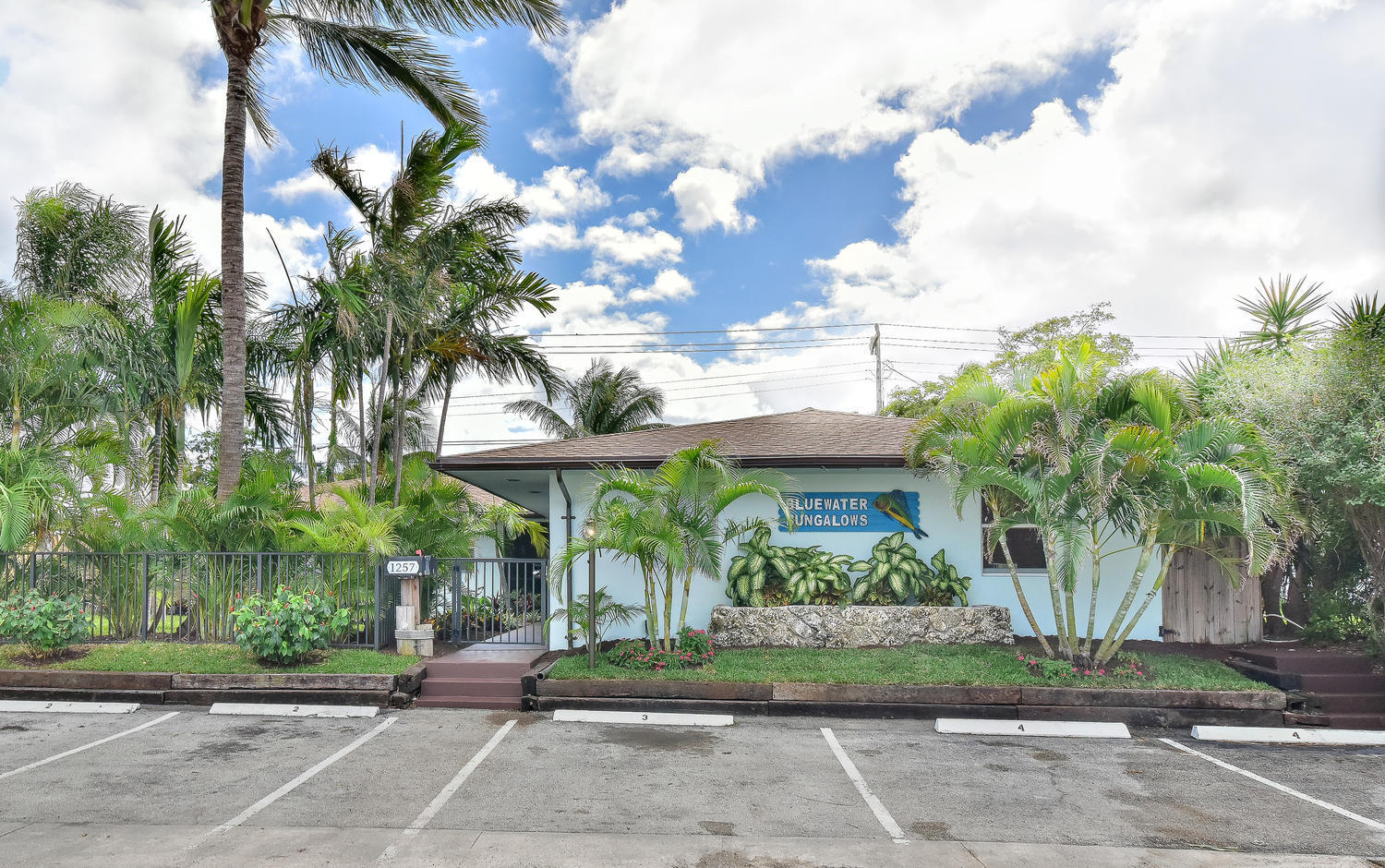 1257 Beach Road Singer Island, FL 33404 - Photo 4 of 71 a view of a yard in front of a house