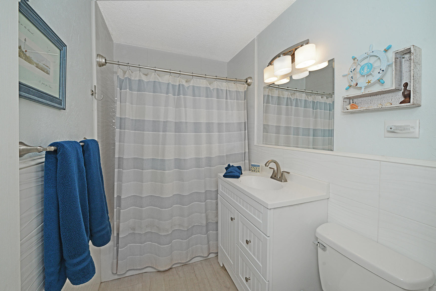 1257 Beach Road Singer Island, FL 33404 - Photo 41 of 71 a bathroom with a sink toilet and shower
