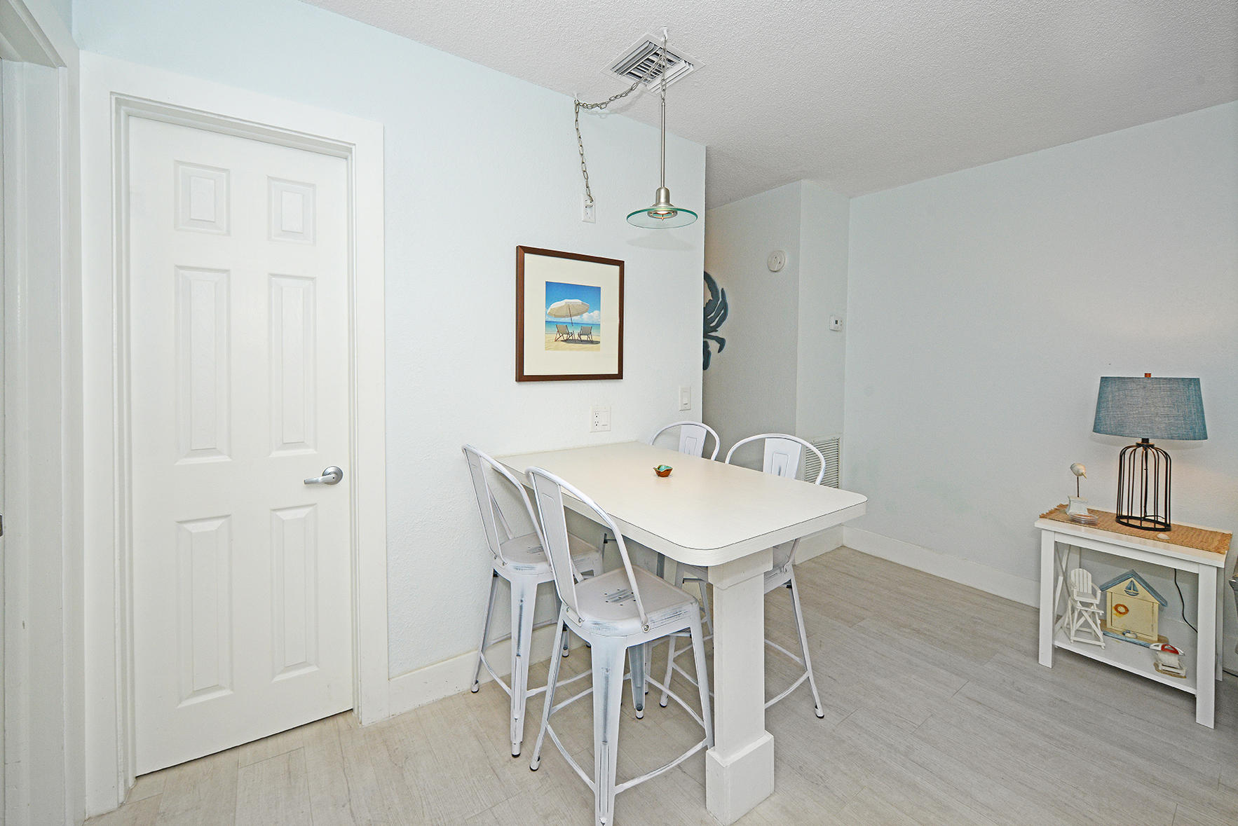 1257 Beach Road Singer Island, FL 33404 - Photo 43 of 71 a view of a dining room with furniture and wooden floor
