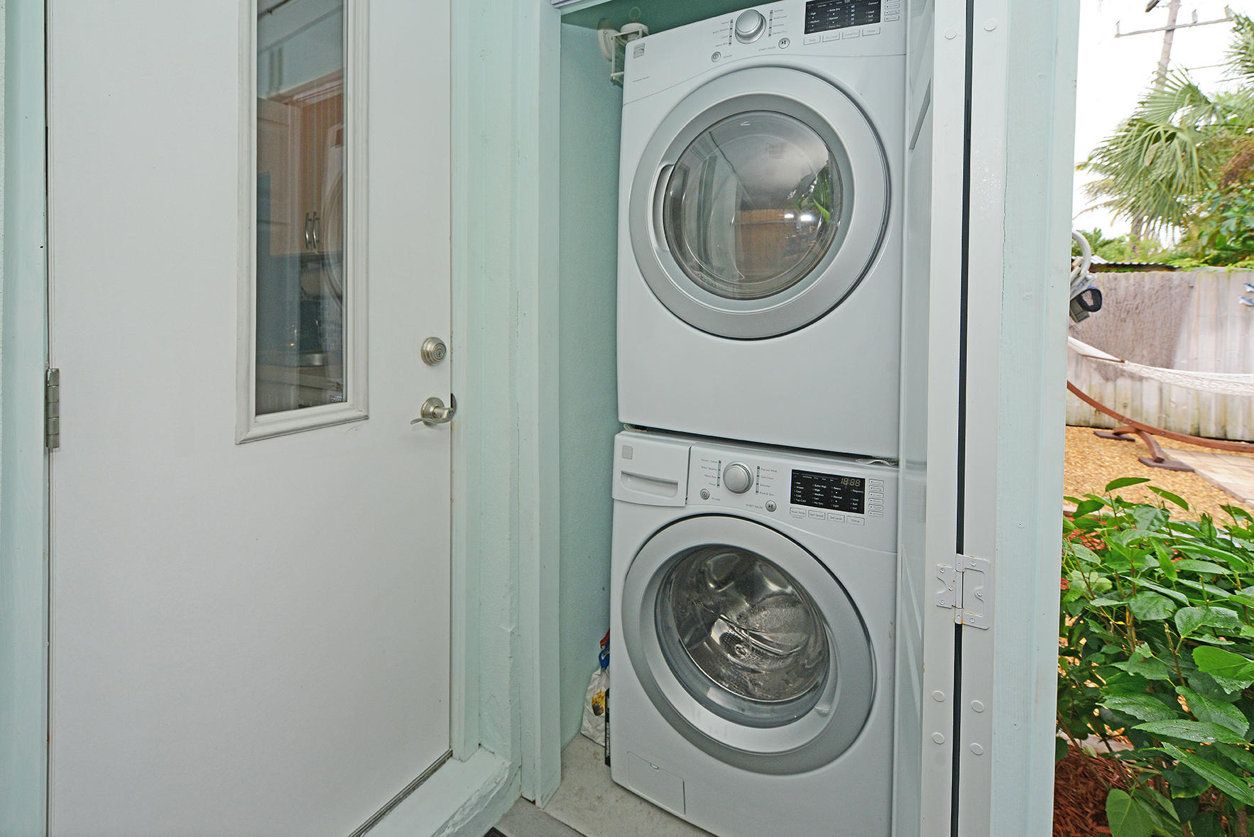 1257 Beach Road Singer Island, FL 33404 - Photo 46 of 71 a utility room with dryer and washer