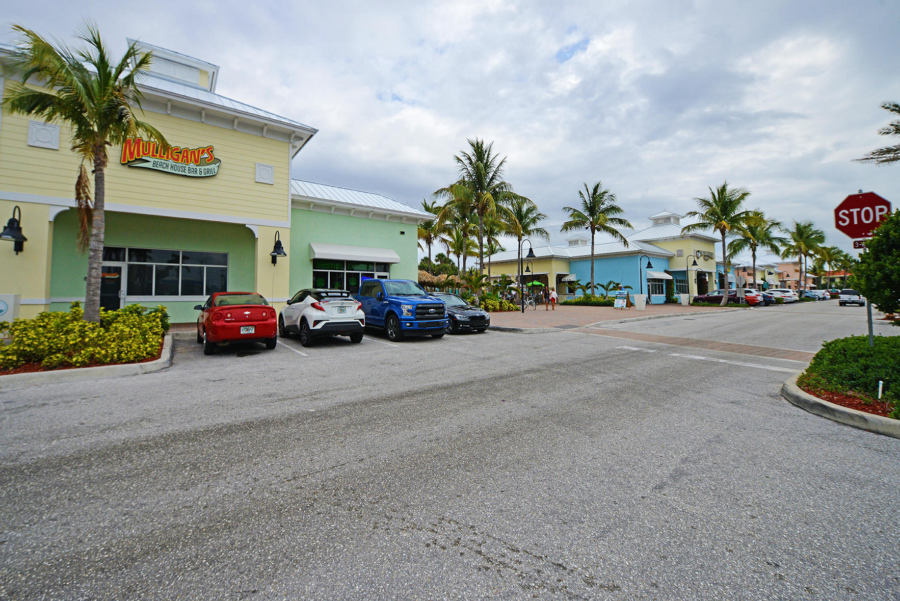 1257 Beach Road Singer Island, FL 33404 - Photo 50 of 71 a group of cars parked in front of a building