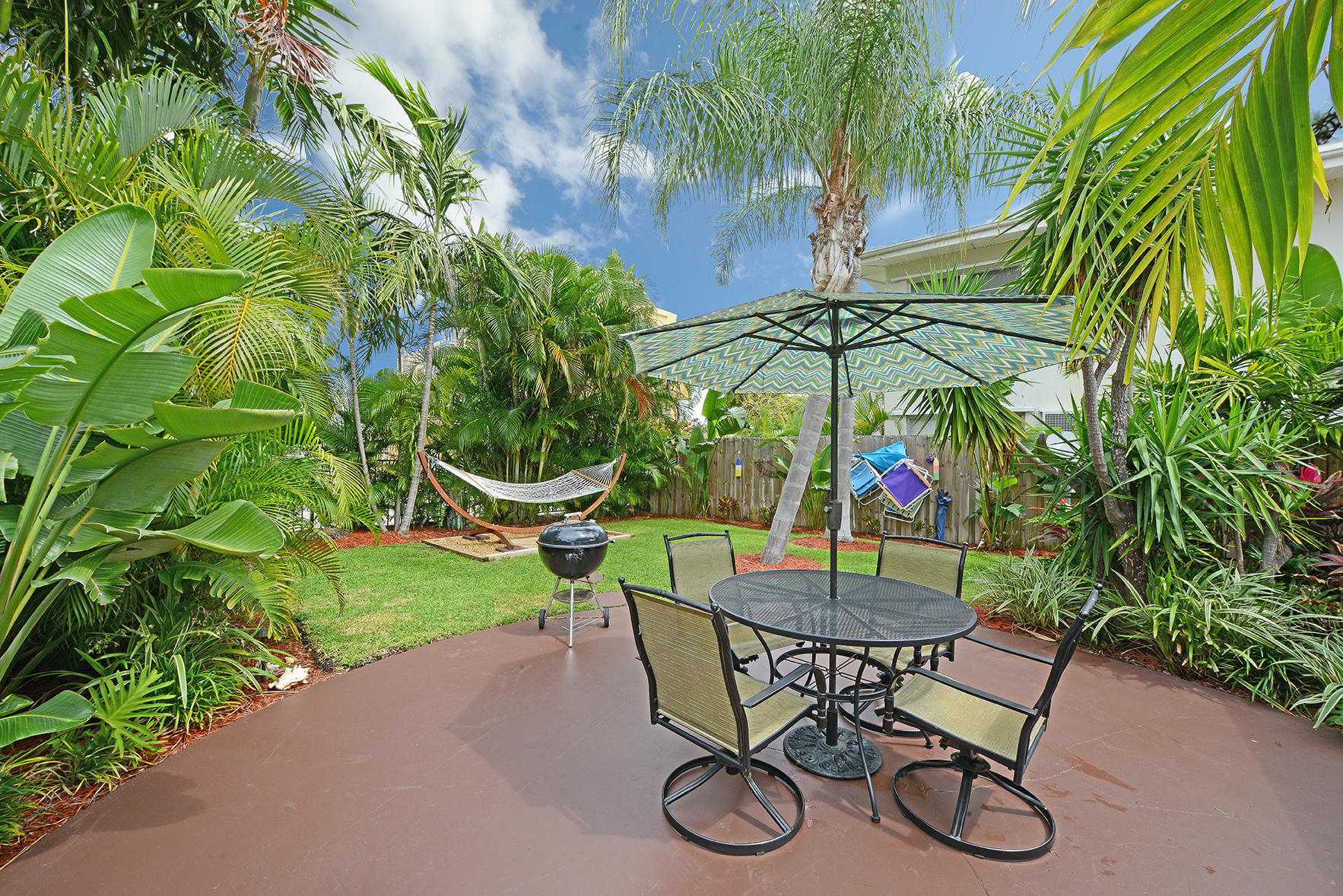 1257 Beach Road Singer Island, FL 33404 - Photo 5 of 71 a view of a table and chairs in patio