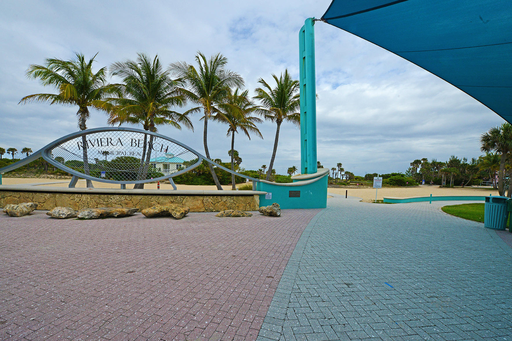 1257 Beach Road Singer Island, FL 33404 - Photo 54 of 71 a view of swimming pool with a yard and palm trees