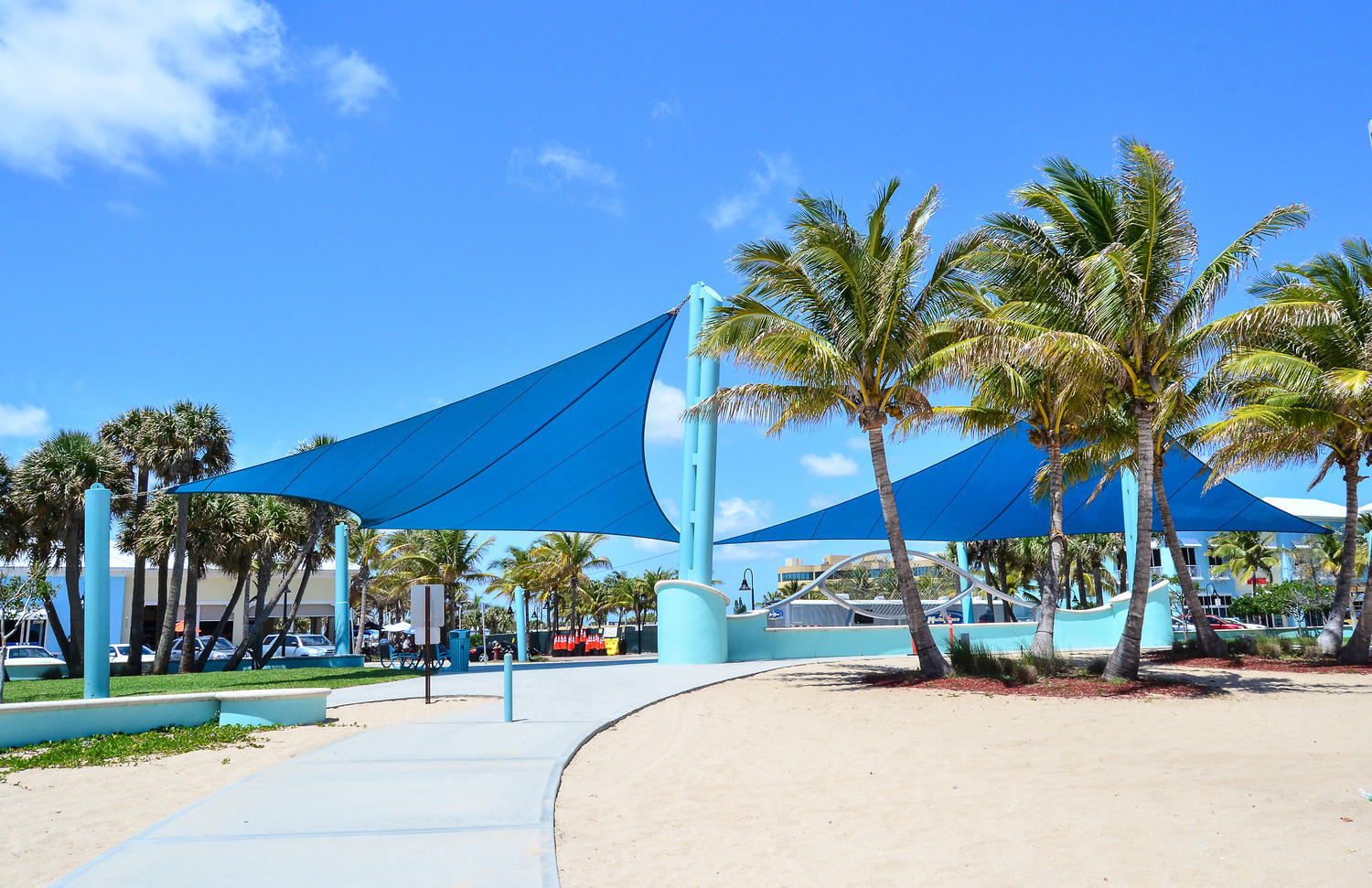 1257 Beach Road Singer Island, FL 33404 - Photo 71 of 71 a view of a table and chairs under an umbrella in front of house