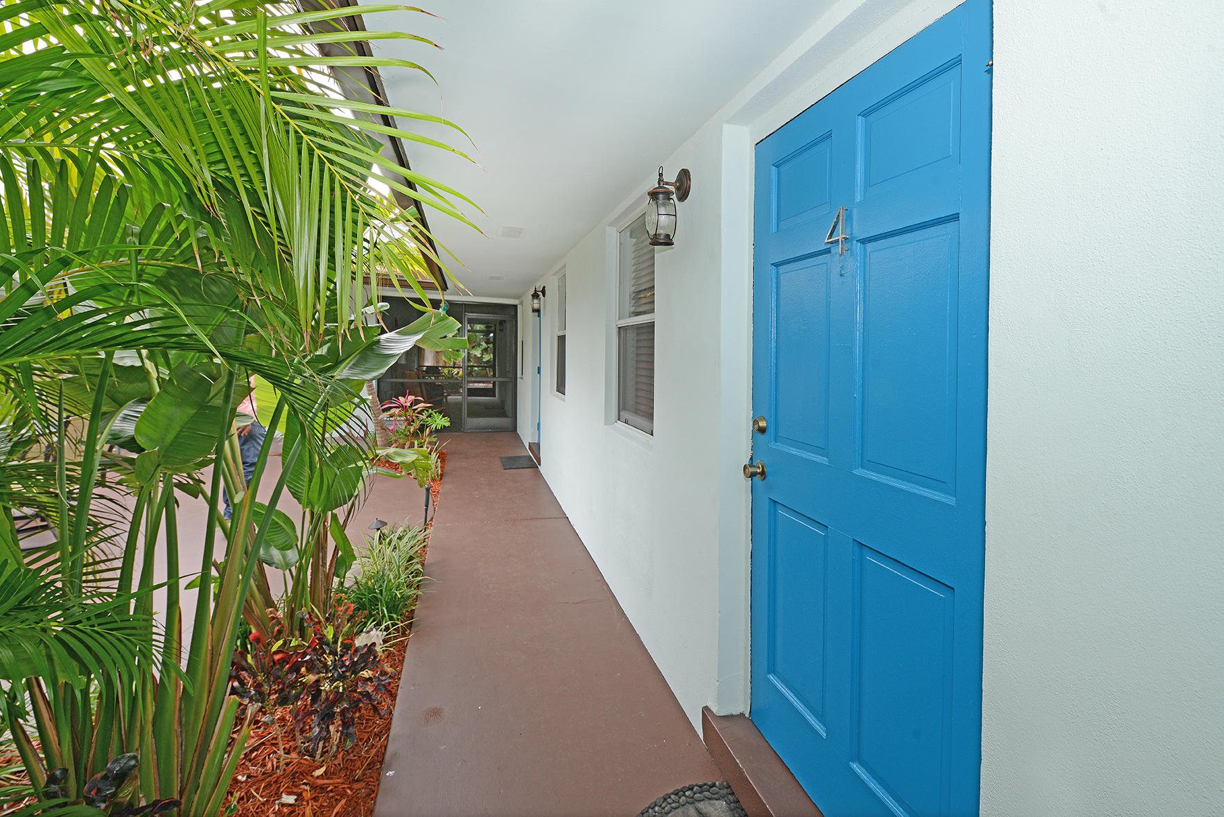 1257 Beach Road Singer Island, FL 33404 - Photo 9 of 71 a view of a potted plant in front of a door